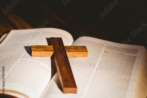 Open bible with crucifix icon