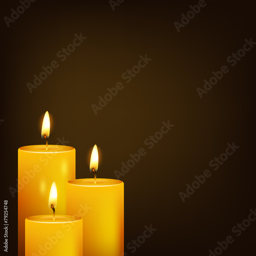 Three candles and dark background