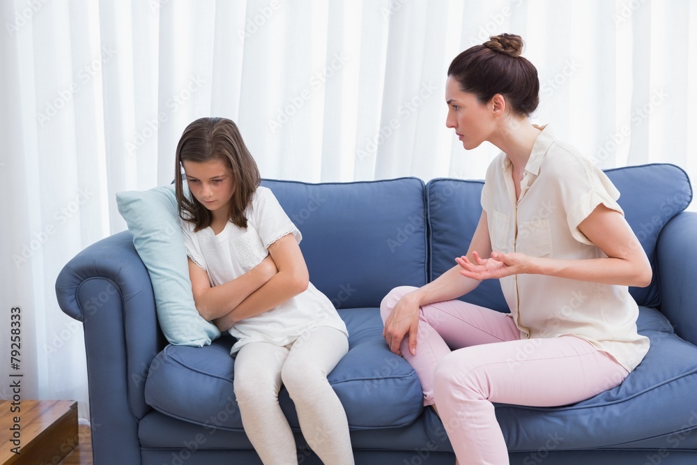 Mother scolding her naughty daughter Mother scolding her naughty daughter