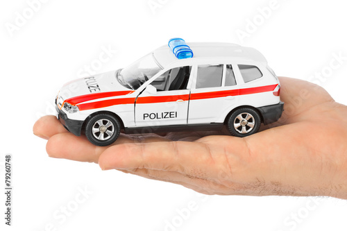 Fototapeta Naklejka Na Ścianę i Meble -  Hand with toy police car