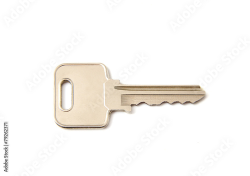 Silver key on a white background