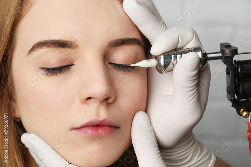 Cosmetologist making perman...