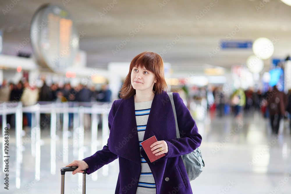 Fototapeta premium Young female passenger at the airport