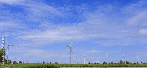 Wind Turbine for alternative energy on background blue  sky . © rtrujira