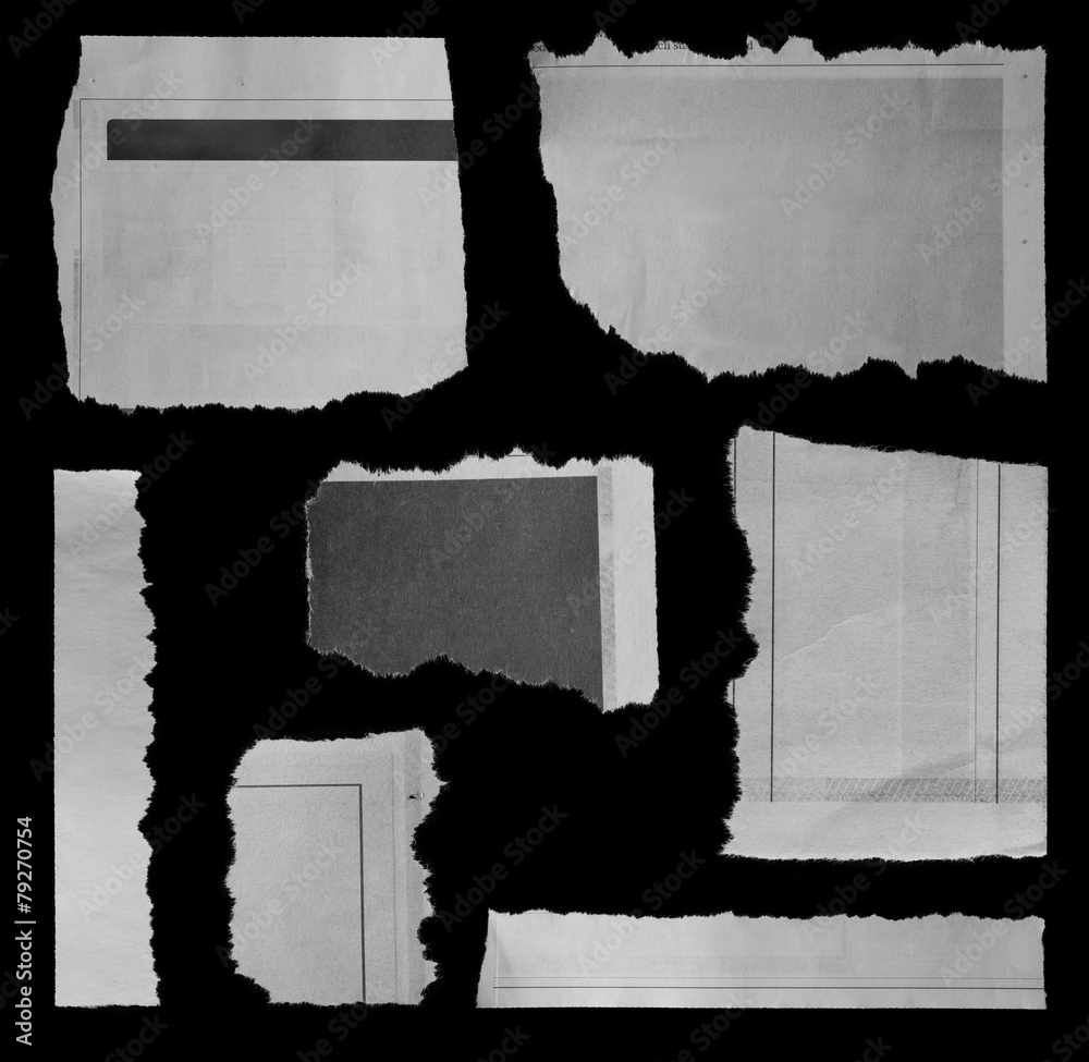 Seven torn papers on black