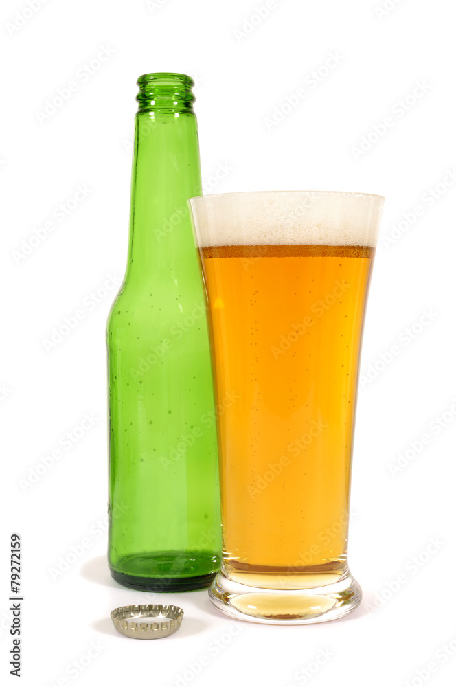 Tall glass of cold beer with empty green bottle isolated on white background photo