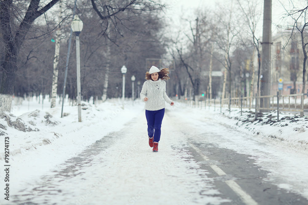 sports running girl in winter sweater