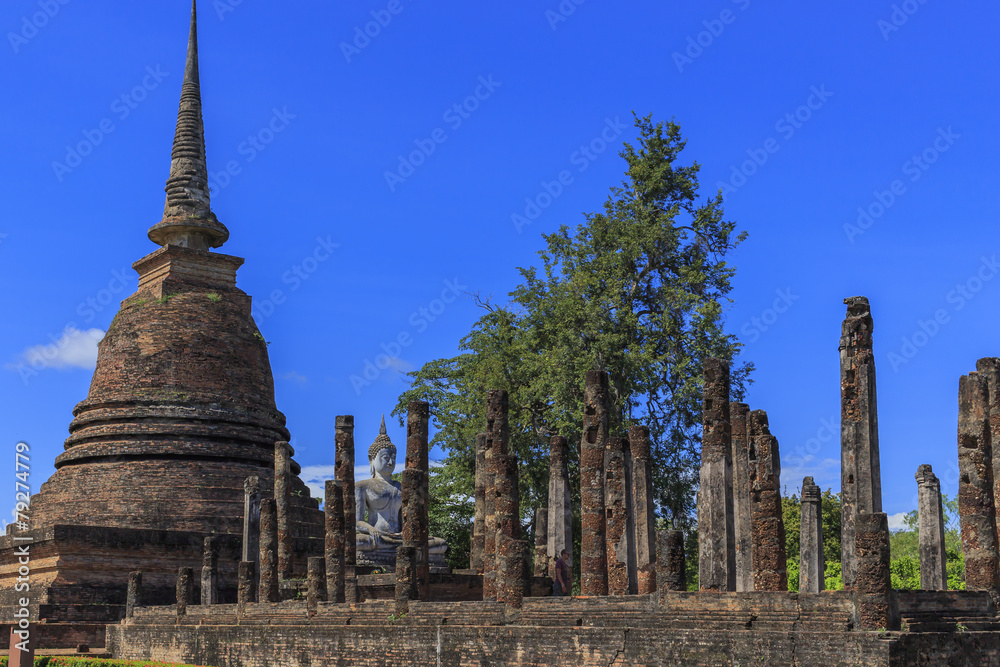 Ancient Buddha statue and pagodas  at Sukhothai Historical Park,