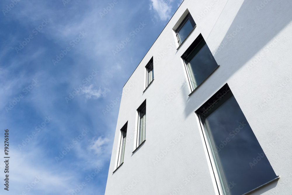 Passive modern building with large windows on a sunny day