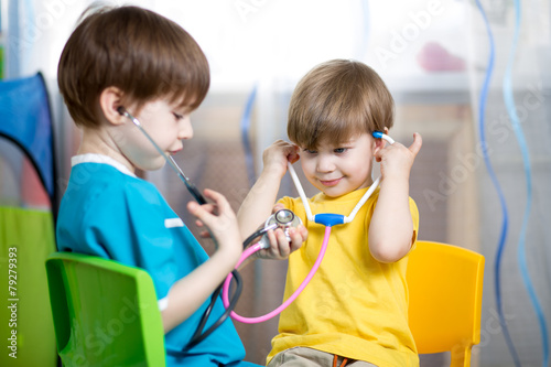 kids boys play doctor at home