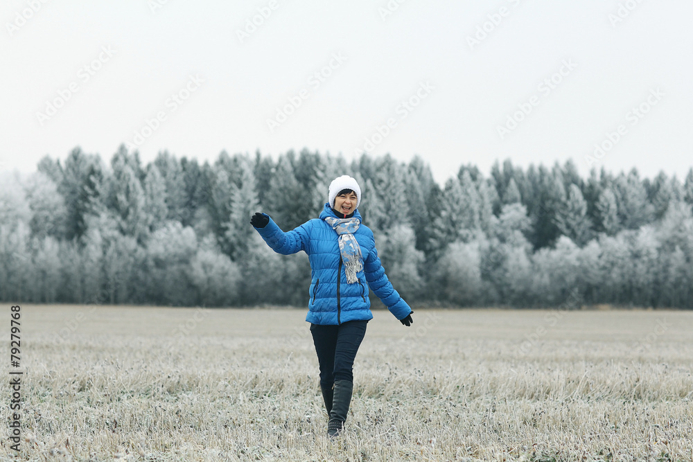 girl in a field of winter frost
