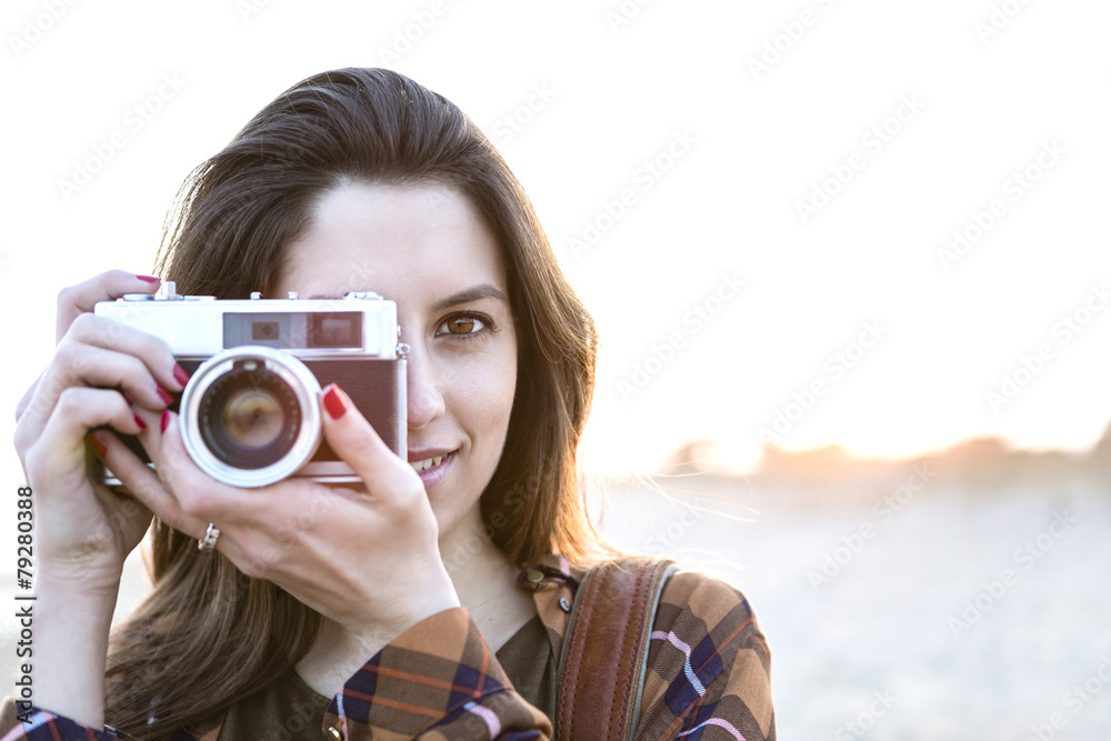 woman with retro photo camera outdoor