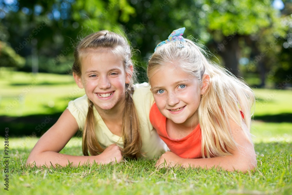 Happy sisters smiling at camera Happy sisters smiling at camera
