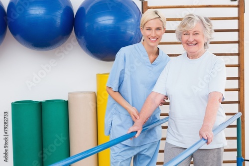 Senior woman and therapist smiling at camera