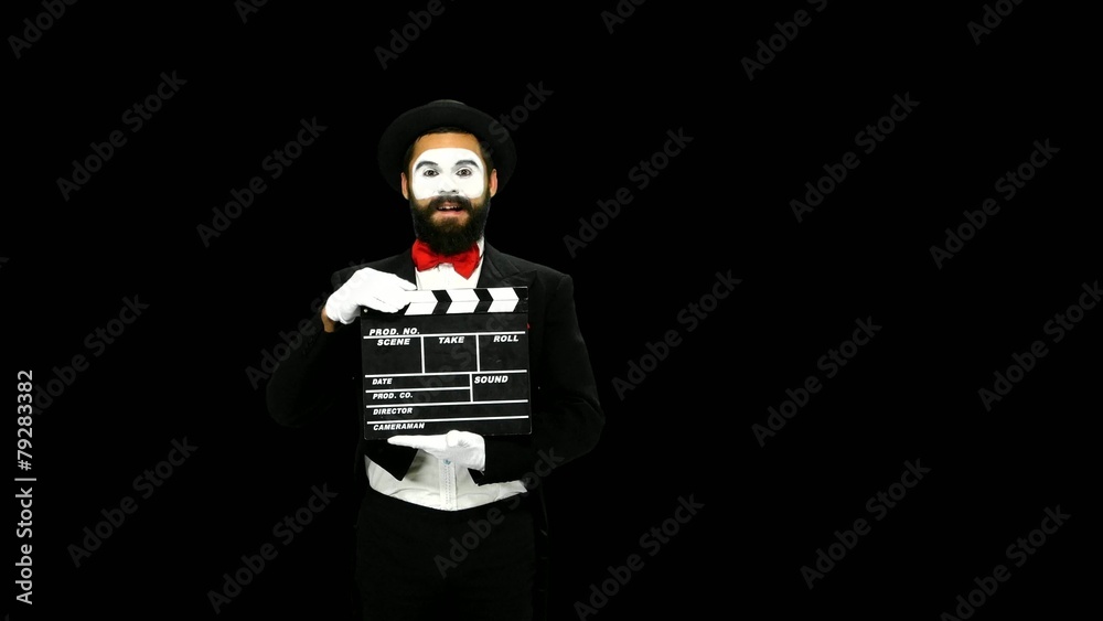 Man mime sneezes using the movie clapper, alpha channel Man mime sneezes using the movie clapper, alpha channel