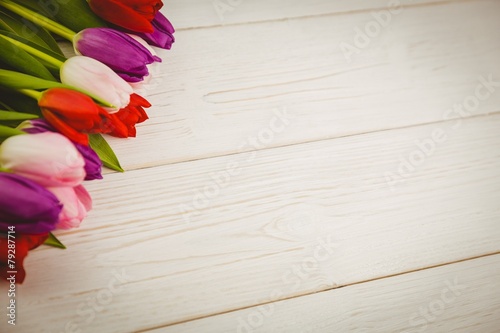 Fototapeta Naklejka Na Ścianę i Meble -  Colorful tulips on wooden table