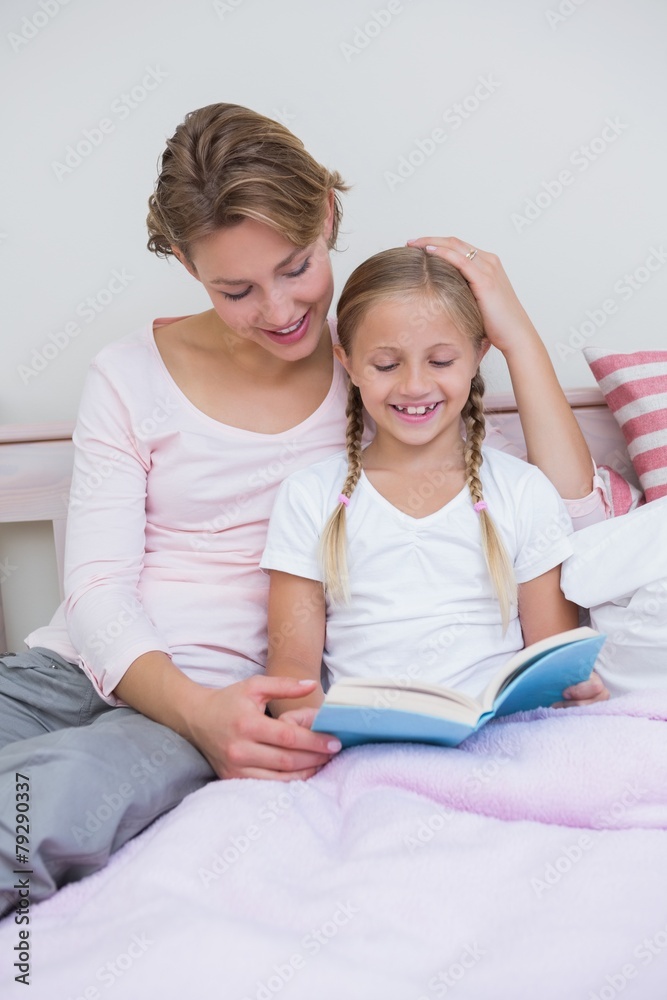 Mother with her daughter at bedtime