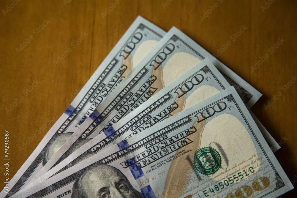 some notes of one hundred US dollars. some notes of one hundred US dollars.