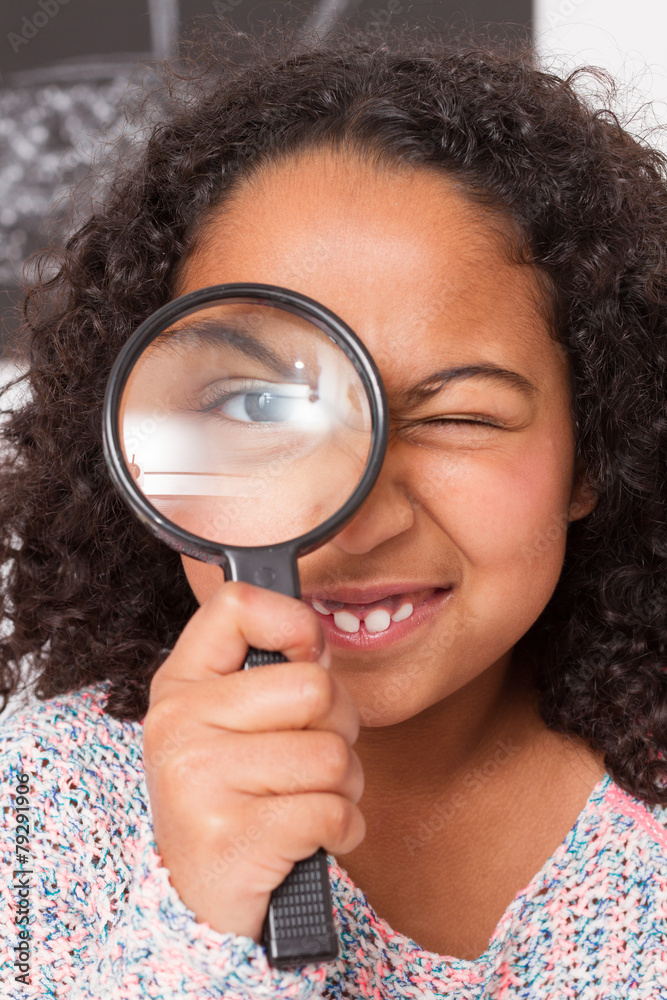 Mixed child playing to explore with magnifying glass Mixed child playing to explore with magnifying glass