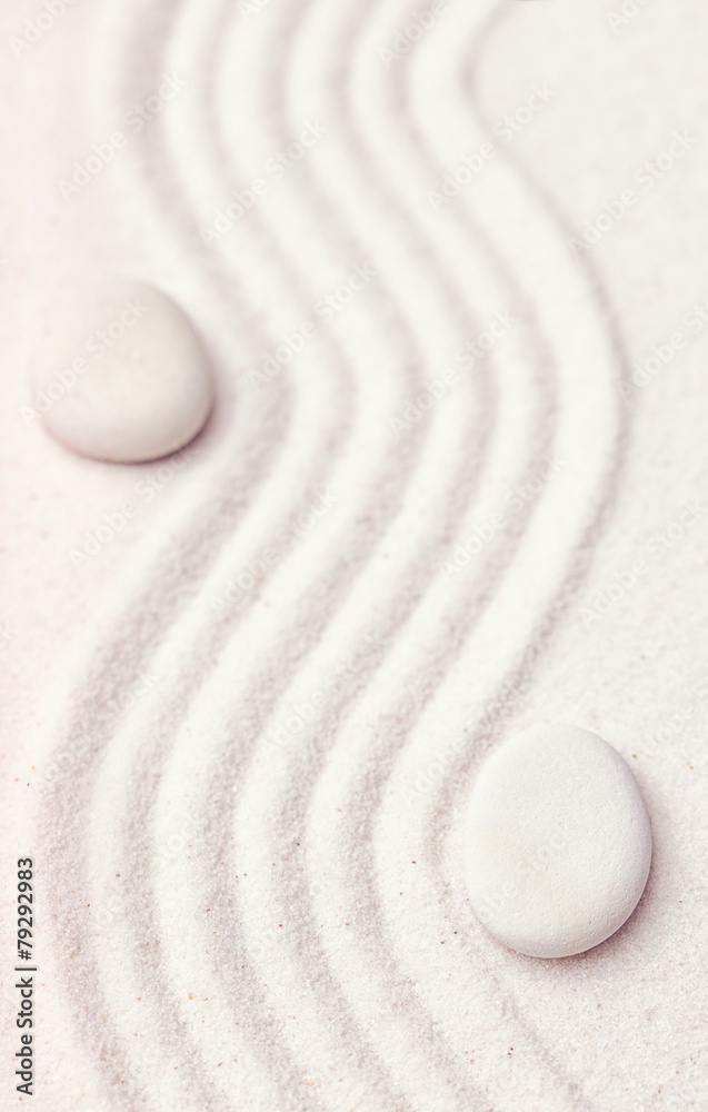 Obraz na plátně Zen garden with a wave lines in the sand with relaxing white sto