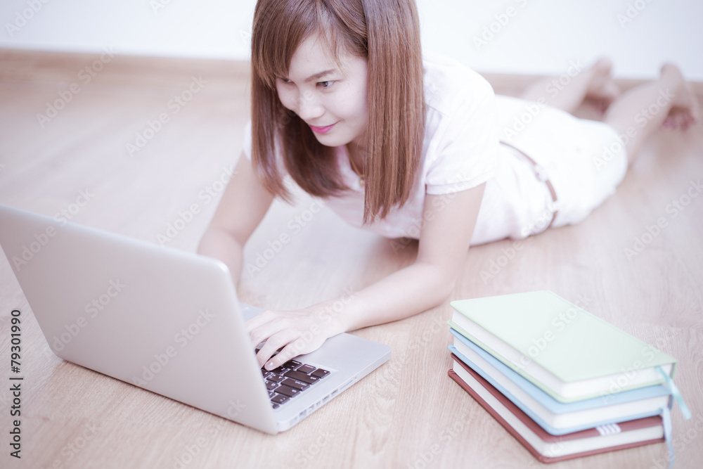 Asian woman using laptop at home Asian woman using laptop at home