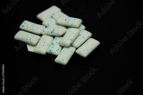 mint candy isolated on blackt background photo