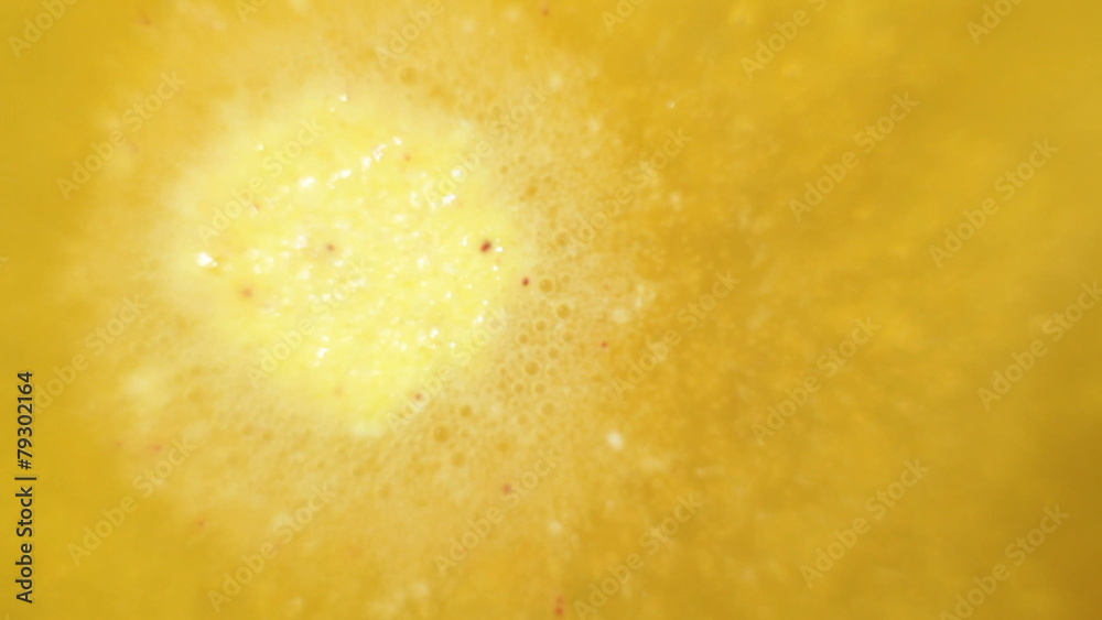 Yellow effervescent tablet bubbling in water Yellow effervescent tablet bubbling in water