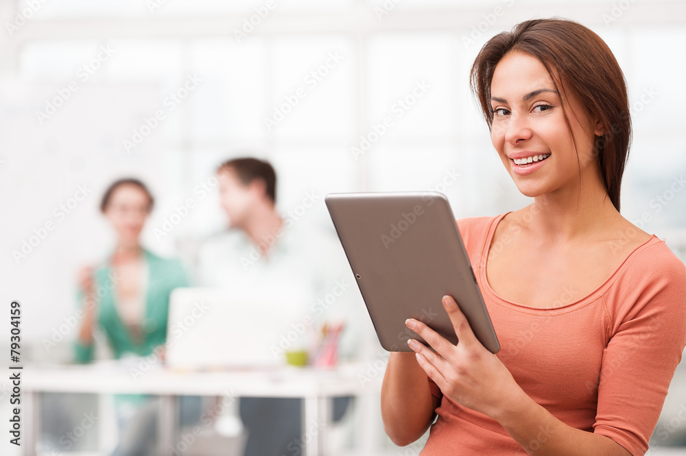 Young smiling mixed race businesswoman with tablet computer Young smiling mixed race businesswoman with tablet computer