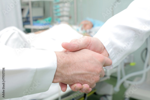 Medical handshake at the bedside