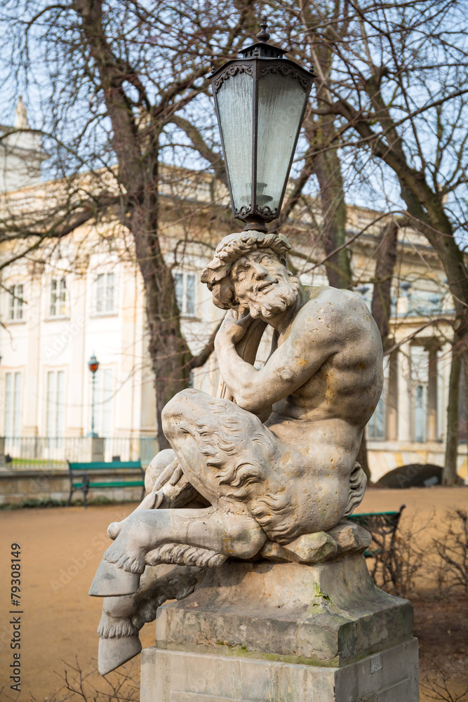 Lantern with sculpture of satyr in Royal Baths Park, Warsaw