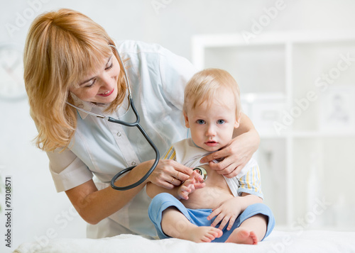 doctor woman examining hear...