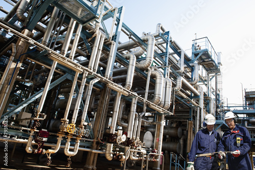 oil workers with main refinery fuel station, oil and gas