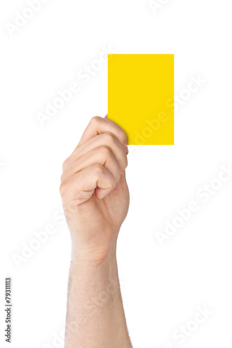 Fotografie Hand holding a yellow card