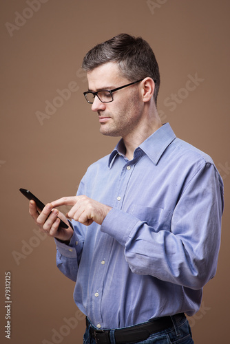 Confident businessman using a smart phone