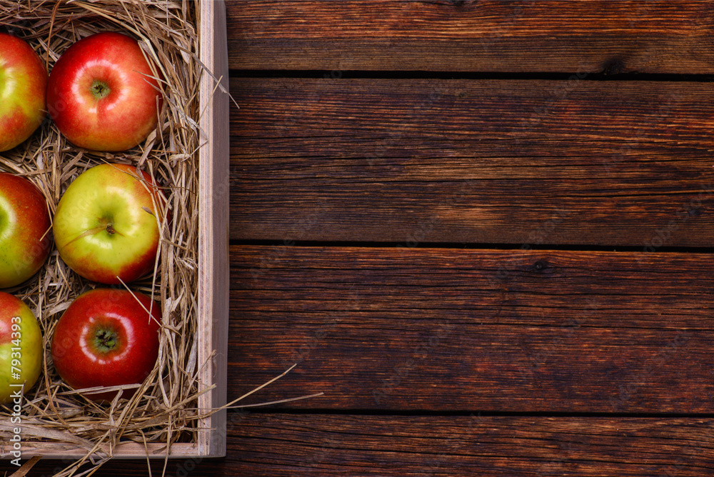 Fresh apples in box on wooden table with copy space Fresh apples in box on wooden table with copy space
