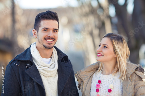 Portrait of happy young couple on the street.