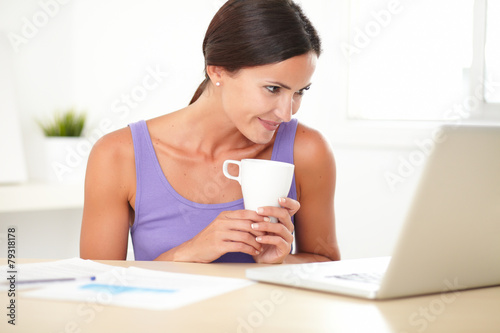 Hispanic woman using the web for business