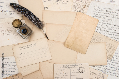 Old letters, vintage postcards and antique feather pen. Mock up