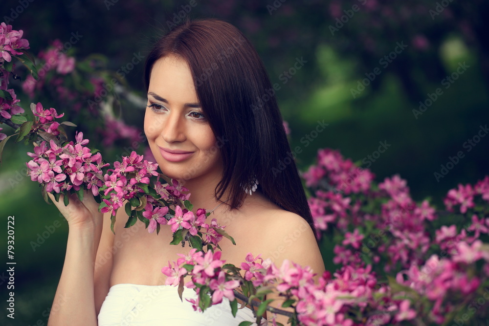 girl in flowers of apple tree girl in flowers of apple tree