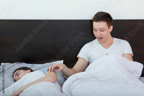 Tableau sur toile man having problem with impotence sitting on bed waking up his