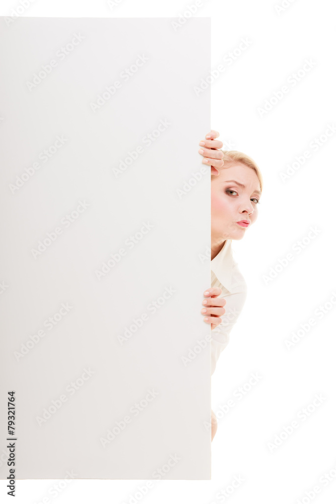 Businesswoman hiding behind blank copy space banner Businesswoman hiding behind blank copy space banner