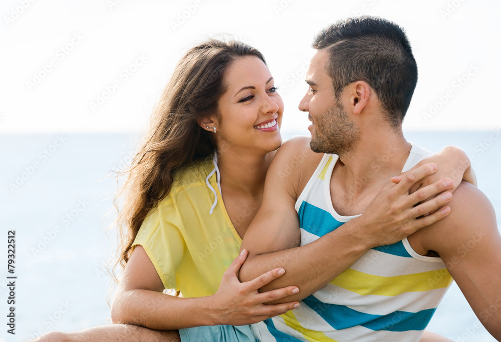 Fototapeta premium Happy pair having romantic date on sandy beach