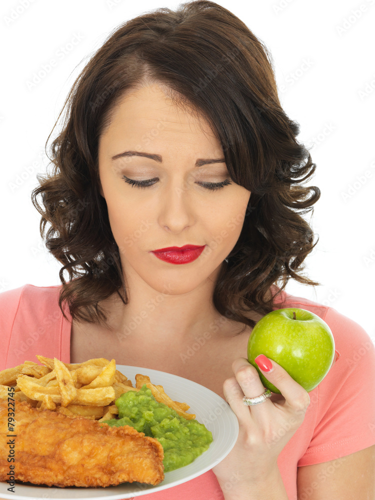 Young Woman Eating Fish and Chips with Mushy Peas Young Woman Eating Fish and Chips with Mushy Peas