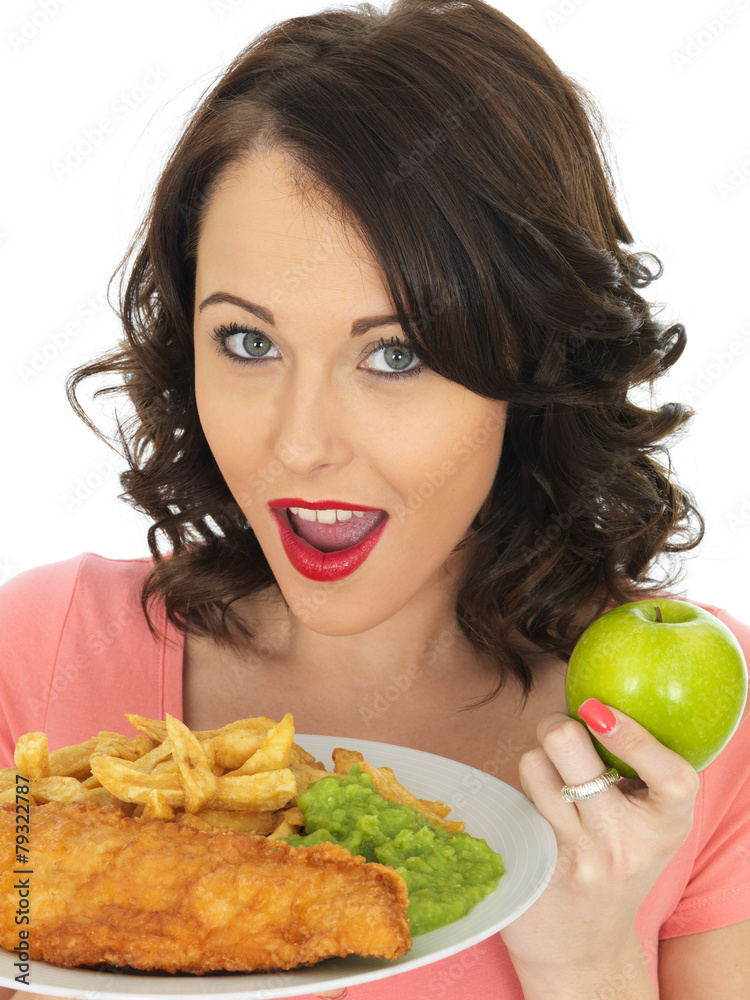 Young Woman Eating Fish and Chips with Mushy Peas Young Woman Eating Fish and Chips with Mushy Peas
