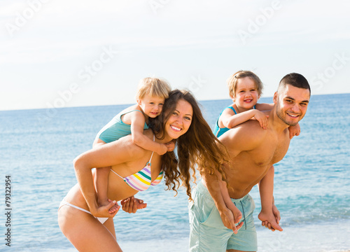 Family of four at the beach