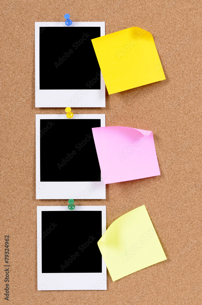Fototapeta premium Vertical row or line of polaroid style blank photo frame print with post it sticky note pinned to cork notice board background