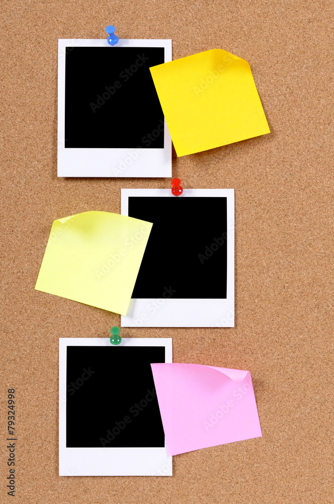 Vertical row or line of polaroid style blank photo frame print with post it sticky note pinned to cork notice board background Vertical row or line of polaroid style blank photo frame print with post it sticky note pinned to cork notice board background