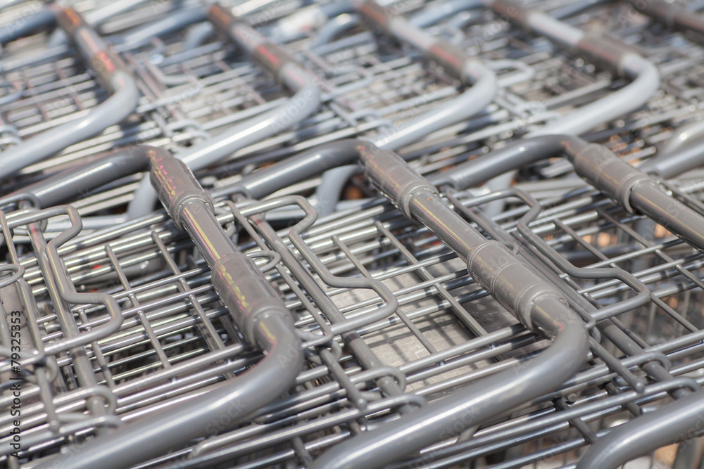 Rows of shopping carts at supermarket entrance Rows of shopping carts at supermarket entrance
