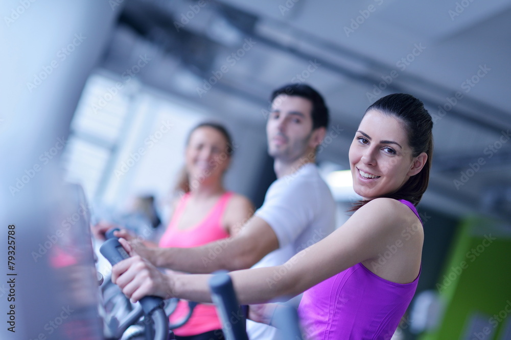 Group of people running on treadmills Group of people running on treadmills
