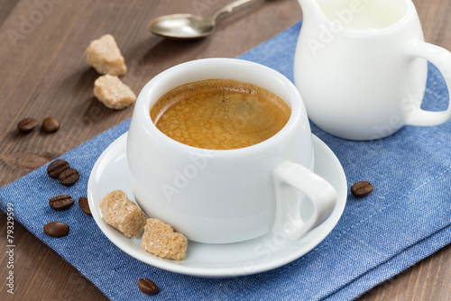 cup of coffee with sugar and milk jug